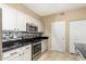 Kitchen with stainless steel appliances and white cabinets at 11260 N 92Nd St # 1102, Scottsdale, AZ 85260