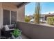 Relaxing patio with seating and view of parking lot at 11260 N 92Nd St # 1102, Scottsdale, AZ 85260