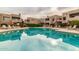 Inviting community pool reflecting building at 11260 N 92Nd St # 1102, Scottsdale, AZ 85260