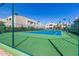 Community tennis court surrounded by fence at 11260 N 92Nd St # 1102, Scottsdale, AZ 85260