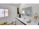 Clean bathroom with white vanity and blue tile accents at 11596 W Sierra Dawn -- # 132, Surprise, AZ 85378