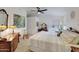 Spacious bedroom with a large bed, dresser, and ceiling fan at 11596 W Sierra Dawn -- # 132, Surprise, AZ 85378