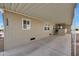 Covered carport with access to the front door at 11596 W Sierra Dawn -- # 132, Surprise, AZ 85378