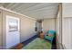 Covered porch with teal chair and welcome mat at 11596 W Sierra Dawn -- # 132, Surprise, AZ 85378