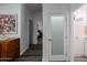 Bright hallway with wood-look floors, offering access to bedrooms and other rooms at 11596 W Sierra Dawn -- # 132, Surprise, AZ 85378