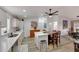 Open kitchen with island, white cabinets, and wood-look flooring at 11596 W Sierra Dawn -- # 132, Surprise, AZ 85378