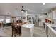 Open concept kitchen with white cabinets and an island at 11596 W Sierra Dawn -- # 132, Surprise, AZ 85378