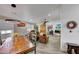 Open concept living area with a rustic dining table and leather furniture at 11596 W Sierra Dawn -- # 132, Surprise, AZ 85378