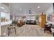 Spacious living room with leather armchairs, a large rug, and a wooden cabinet at 11596 W Sierra Dawn -- # 132, Surprise, AZ 85378