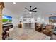 Bright living room featuring a fireplace, comfy seating, and a large TV at 11596 W Sierra Dawn -- # 132, Surprise, AZ 85378