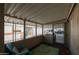Cozy screened porch with teal chair and area rug at 11596 W Sierra Dawn -- # 132, Surprise, AZ 85378