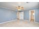 Large bedroom with neutral walls and ceiling fan at 14595 S Tampico Rd, Arizona City, AZ 85123