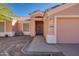 Front view of charming house with walkway and garage at 14595 S Tampico Rd, Arizona City, AZ 85123