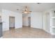 Spacious living room with tile floors and ceiling fan at 14595 S Tampico Rd, Arizona City, AZ 85123