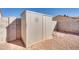 Metal storage shed in backyard provides extra storage at 14595 S Tampico Rd, Arizona City, AZ 85123