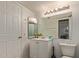 Clean bathroom with a vanity, toilet, and large mirror at 1645 W Baseline Rd # 2041, Mesa, AZ 85202