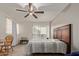 Well-lit bedroom with a ceiling fan and access to a balcony at 1645 W Baseline Rd # 2041, Mesa, AZ 85202