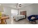 Cozy bedroom with a bed, round chair and side table at 1645 W Baseline Rd # 2041, Mesa, AZ 85202