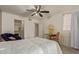 Bright bedroom featuring a ceiling fan and comfortable seating at 1645 W Baseline Rd # 2041, Mesa, AZ 85202