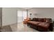 Living room with sectional sofa and access to patio at 1645 W Baseline Rd # 2041, Mesa, AZ 85202