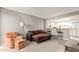 Living room with brown sectional sofa and kitchen bar at 1645 W Baseline Rd # 2041, Mesa, AZ 85202