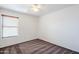 Spacious bedroom with ceiling fan and window blinds at 16649 W Polk St, Goodyear, AZ 85338