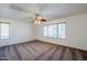 Well-lit bedroom, featuring a ceiling fan and window at 16649 W Polk St, Goodyear, AZ 85338