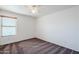 Bright bedroom with ceiling fan and window blinds at 16649 W Polk St, Goodyear, AZ 85338