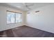 Spacious bedroom with ceiling fan and large window at 16649 W Polk St, Goodyear, AZ 85338