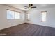 Spacious bedroom with neutral carpeting and window blinds at 16649 W Polk St, Goodyear, AZ 85338