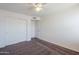 Bedroom with double door closet and carpet flooring at 16649 W Polk St, Goodyear, AZ 85338