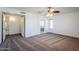 Spacious bedroom with ceiling fan and en-suite bathroom at 16649 W Polk St, Goodyear, AZ 85338
