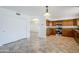 Open kitchen features granite counters and wood cabinets at 16649 W Polk St, Goodyear, AZ 85338