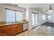 Kitchen with wood cabinets, granite countertops, and stainless steel dishwasher at 16649 W Polk St, Goodyear, AZ 85338