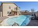 Relaxing kidney-shaped pool with rock landscaping at 16649 W Polk St, Goodyear, AZ 85338