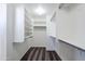 Spacious walk-in closet with built-in shelves and hanging rods at 16649 W Polk St, Goodyear, AZ 85338