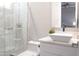 Modern bathroom with white sink, herringbone tile shower, and glass enclosure at 1710 W Glacier Way, Chandler, AZ 85248