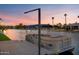 Sunset view of a private boat dock with pontoon boat at 1710 W Glacier Way, Chandler, AZ 85248