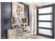 Bright entryway with modern console table and chandelier at 1710 W Glacier Way, Chandler, AZ 85248