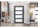 Modern entryway, featuring a statement art piece and herringbone floors at 1710 W Glacier Way, Chandler, AZ 85248