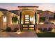 Elegant entryway with modern glass door and landscaping at 1710 W Glacier Way, Chandler, AZ 85248