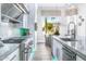 Bright kitchen with stainless steel appliances and marble countertops at 1710 W Glacier Way, Chandler, AZ 85248