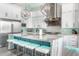 Gourmet kitchen with large island, stainless steel appliances, and modern finishes at 1710 W Glacier Way, Chandler, AZ 85248