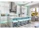 Modern kitchen features a large island with seating and breakfast nook at 1710 W Glacier Way, Chandler, AZ 85248