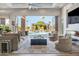 Spacious living room with a fireplace, pool view, and comfortable seating at 1710 W Glacier Way, Chandler, AZ 85248