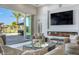 Living area features a fireplace, comfortable seating, and a view of the pool at 1710 W Glacier Way, Chandler, AZ 85248