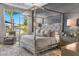 Spacious main bedroom with canopy bed, sitting area and backyard views at 1710 W Glacier Way, Chandler, AZ 85248