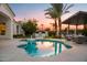 Relaxing freeform pool and patio with outdoor kitchen at 1710 W Glacier Way, Chandler, AZ 85248