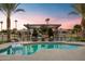 Inviting pool and patio area with pergola and canal view at 1710 W Glacier Way, Chandler, AZ 85248