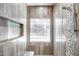 Spa-like shower with tile surround, glass block window, and built-in seat at 1710 W Glacier Way, Chandler, AZ 85248